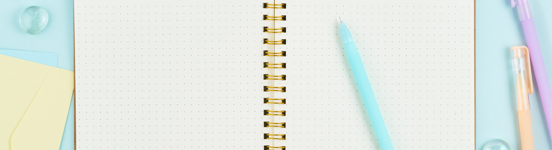 Close up of an open notebook and pen